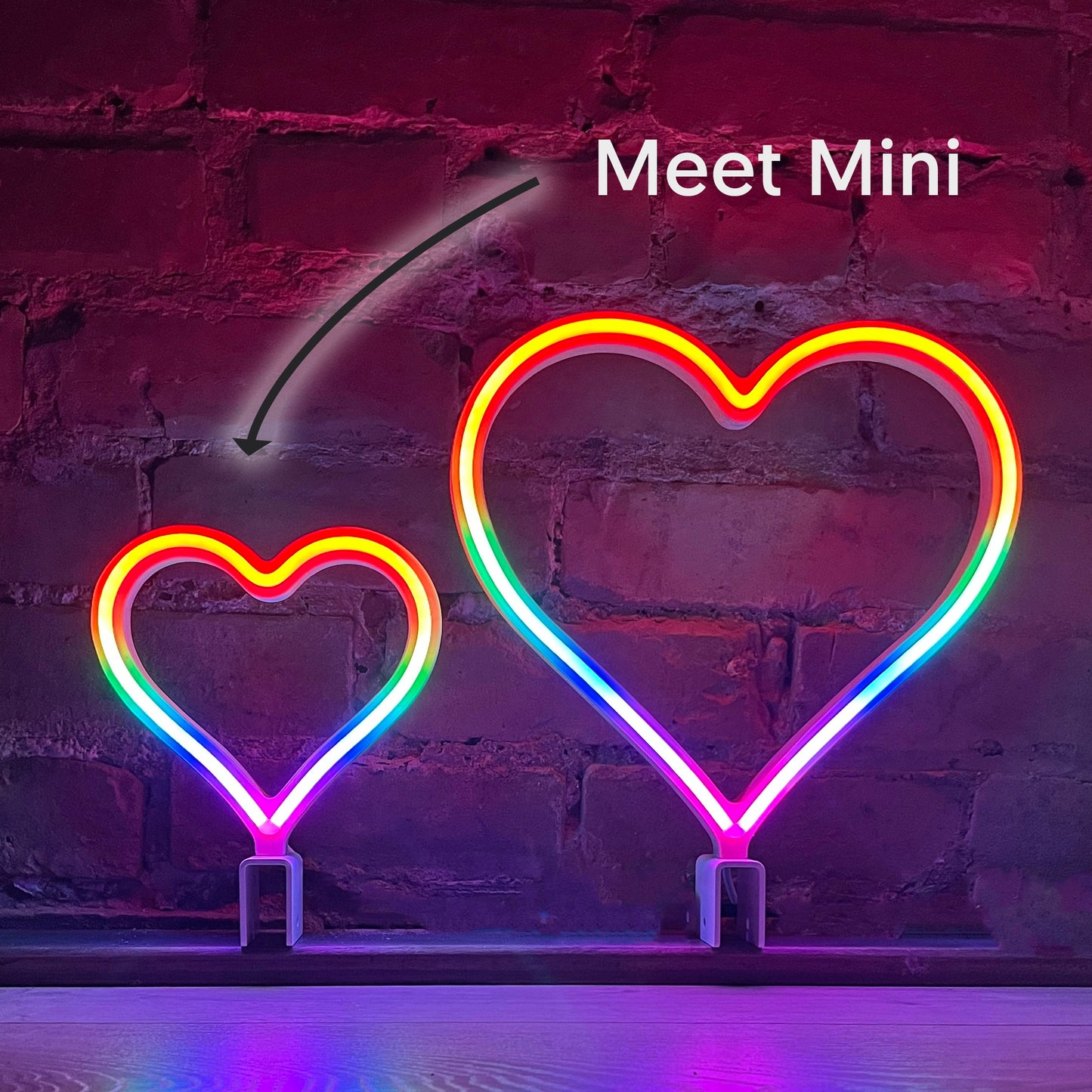 Meet Mini - size comparison of 7 inch MINI and 12 inch original Signature Rainbow neon heart art side by side by Our Glowing Hearts