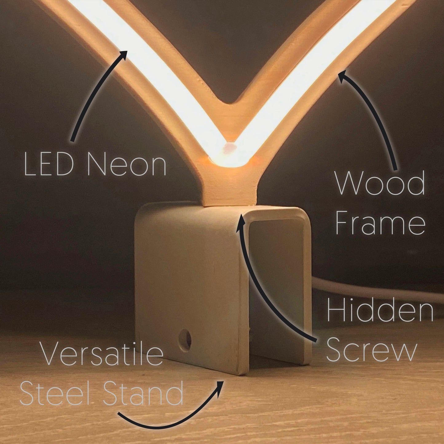 Close-up of mini warm white neon heart art construction showing LED neon tubing wood frame hidden screw mount and versatile steel baseplate stand by Our Glowing Hearts