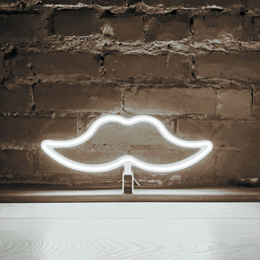 Cool white neon moustache art glowing against a brick wall - Movember LED neon moustache light by Our Glowing Hearts handmade in Canada