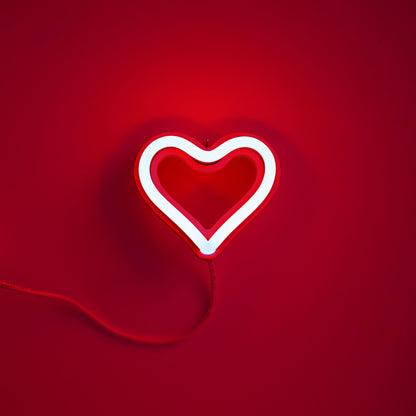 Red neon heart ornament glowing on red background - 3.5 inch LED neon ornament by Our Glowing Hearts handmade in Canada