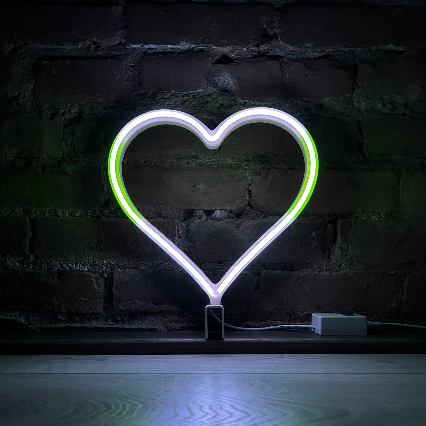 Neon Queer Heart art in agender pride flag colors - green and white LED neon heart light mode by Our Glowing Hearts