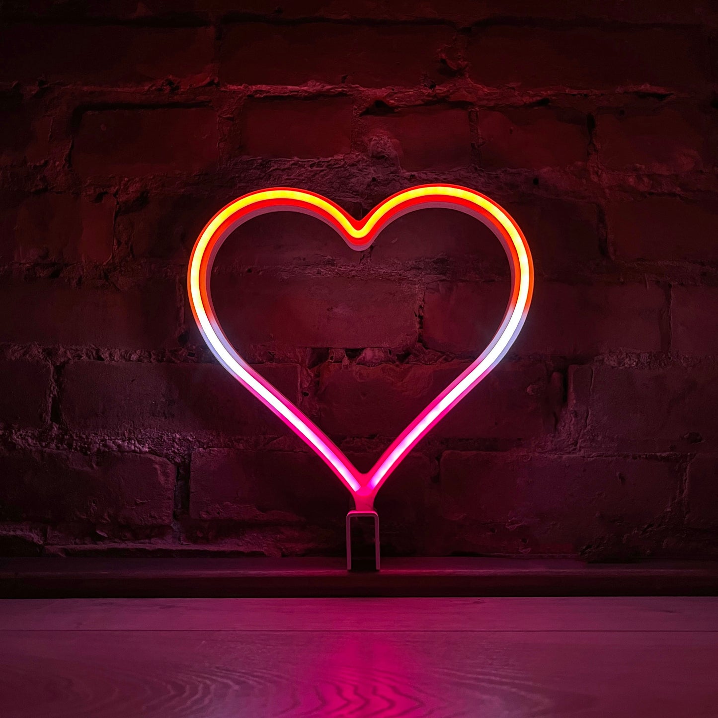 Neon Queer Heart art in lesbian pride flag colors - red orange yellow white and pink LED neon heart light mode by Our Glowing Hearts