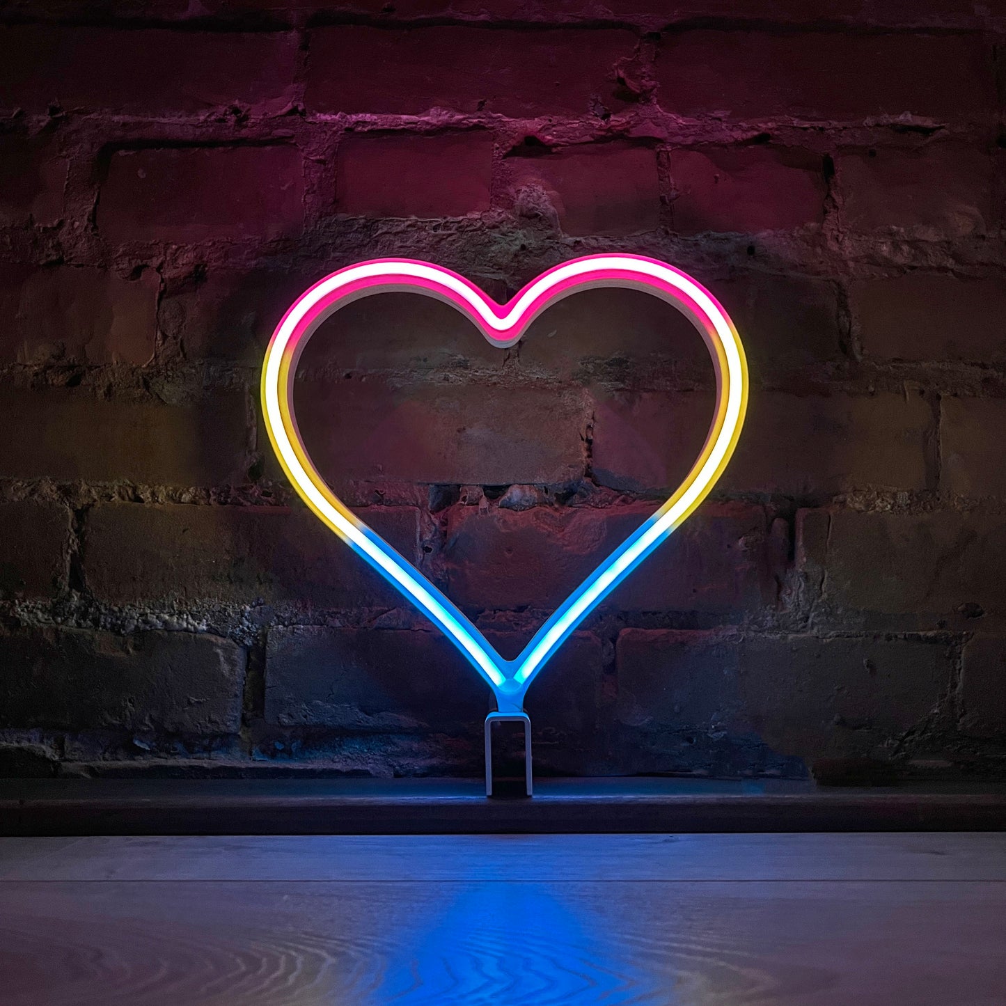 Neon Queer Heart art in pansexual pride flag colors - pink yellow and blue LED neon heart light mode by Our Glowing Hearts
