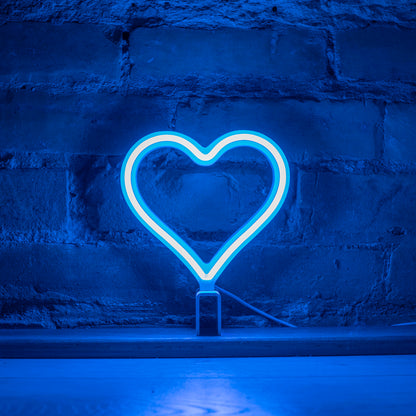 Mini cyan neon heart art glowing against a brick wall - 7 inch LED neon heart light by Our Glowing Hearts handmade in Canada