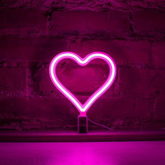 Mini pink neon heart art glowing against a brick wall - 7 inch LED neon heart light by Our Glowing Hearts handmade in Canada