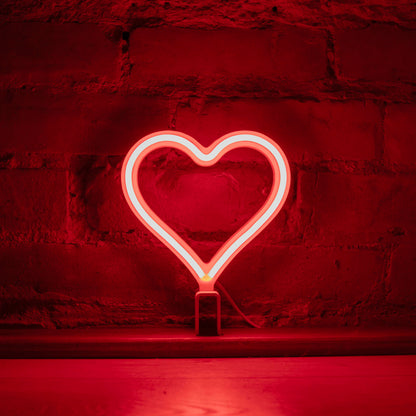 Mini red neon heart art glowing against a brick wall - 7 inch LED neon heart light by Our Glowing Hearts handmade in Canada