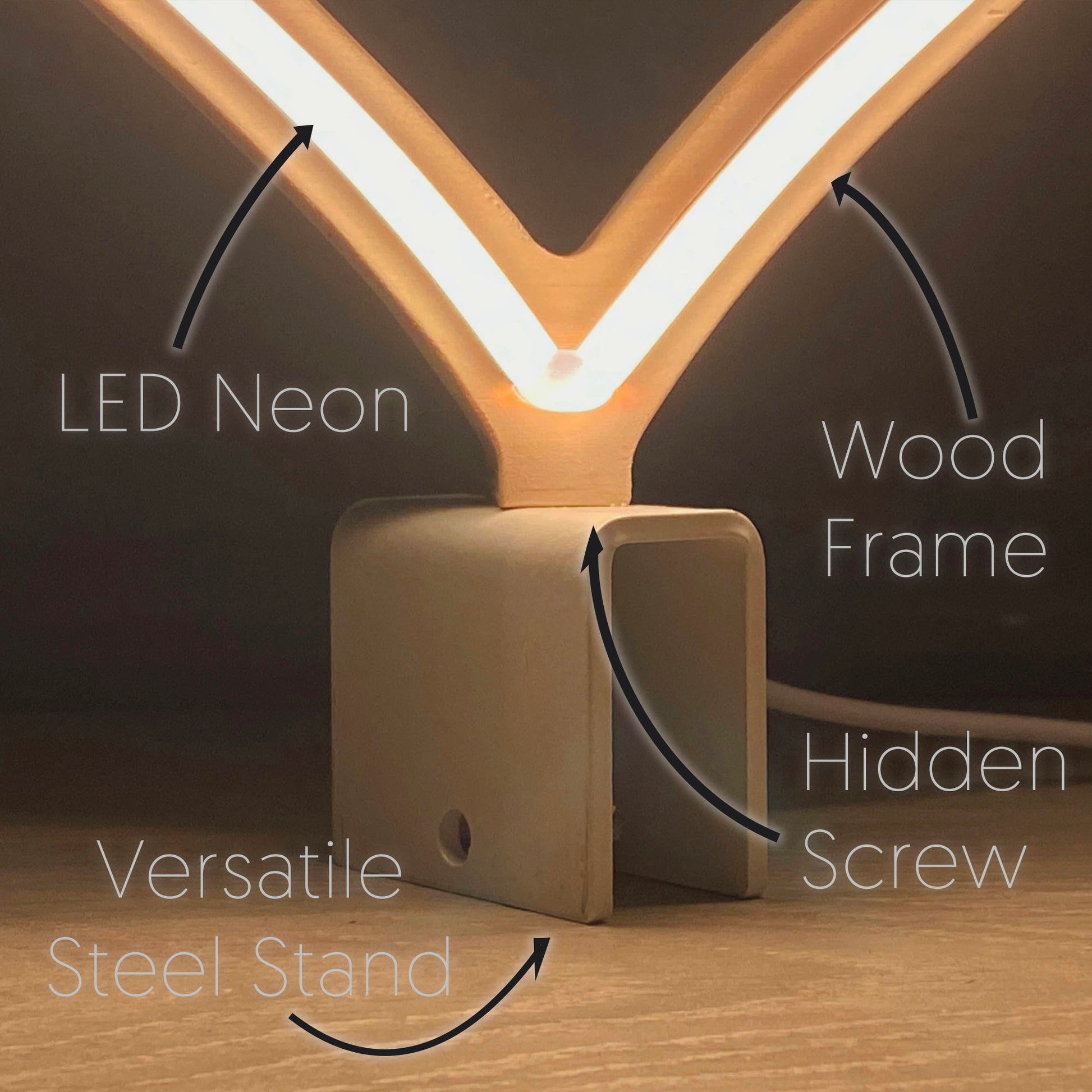 Close-up of mini warm white neon heart art construction showing LED neon tubing wood frame hidden screw mount and versatile steel baseplate stand by Our Glowing Hearts